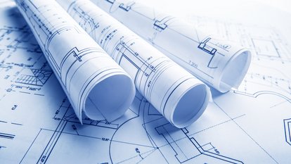 Referat 21 - Planfeststellung Pläne auf einem Tisch
